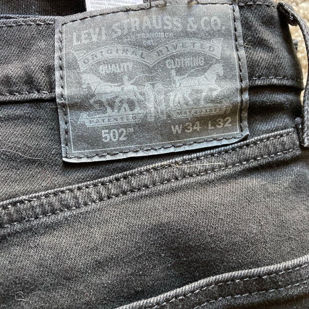 Men's Black Levi.  502s in size 34 W, 32 L
